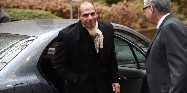 Greek Finance Minister Yanis Varoufakis (L) arrives on February 20, 2015 for an emergency Eurogroup finance ministers meeting at the European Council in Brussels. Last minute wrangling delayed a make or break eurozone meeting on February 20 as Greece's demand for a radical easing of its bailout program ran into German-led opposition to easing its austerity commitments. After days of sharp exchanges, the 19 eurozone finance ministers were gathered for the third time in little over a week to consi