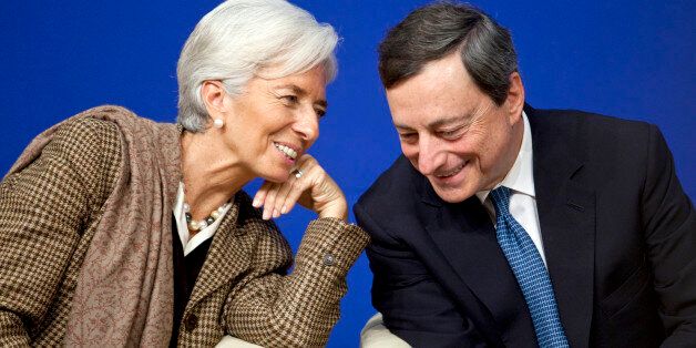 Christine Lagarde, managing director of the International Monetary Fund (IMF), left, speaks with Mario Draghi, president of the European Central Bank (ECB), during a financial conference at the Ministry of Economy, Finance and Industry in Paris, France, on Friday, Nov. 30, 2012. The European Central Bank will do 'whatever is necessary to save euro' and is ready to intervene when needed, Draghi said, while saying 'there will always be conditions' to intervention. Photographer: Balint Porneczi/Bloomberg via Getty Images