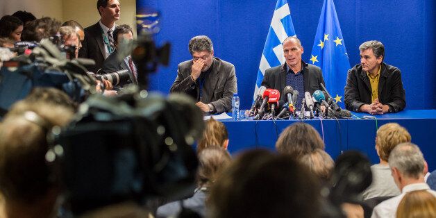 Greece's Finance Minister Yanis Varoufakis, 2nd right, addresses the media after a meeting of Eurogroup finance ministers at the EU Council building in Brussels on Monday, Feb. 16, 2015. Greeceâs radical left government and its European creditors headed into new talks Monday on the debt-heavy countryâs stuttering bailout program, but expectations are low despite a fast-approaching deadline for some kind of deal. (AP Photo/Geert Vanden Wijngaert)