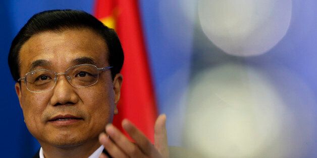 Chinese Premier Li Keqiang speaks and gestures during a press conference on China - Central and Eastern Europe meeting of heads of government in Belgrade, Serbia, Tuesday, Dec. 16, 2014. Chinese Prime Minister Li Keqiang, accompanied by a cohort of 200 corporate executives, met the leaders of 16 central and eastern European countries in Belgrade, Serbia, on Tuesday. Their two-day summit has been billed in China as an opportunity not only to deepen its ties in the region, but also to boost relations with the EU. (AP Photo/Darko Vojinovic)