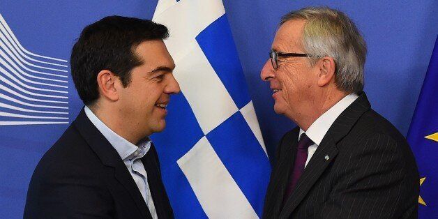 European Commission President Jean-Claude Juncker (R) greets Greek Prime Minister Alexis Tsipras at European Commission headquarters in Brussels on February 4, 2015. The euro held its gains on February 4 after a surge driven by growing optimism that Greece will hammer out a debt deal and avoid a possible default. AFP PHOTO / EMMANUEL DUNAND (Photo credit should read EMMANUEL DUNAND/AFP/Getty Images)