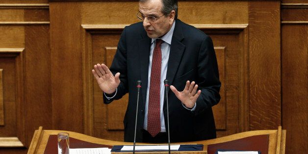 Greece's former Prime Minister Antonis speaks during a parliament session before the conference vote in Athens, on Tuesday, Feb. 10, 2015. Greece's newly elected government was due to receive a vote of confidence from the newly-elected parliament late Tuesday, and his ministers insisted they would stick to their election pledges â halting major privatization plans and reversing austerity taxes demanded by bailout lenders.(AP Photo/Petros Giannakouris)