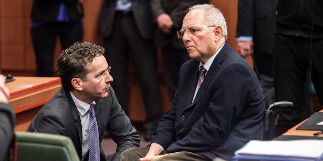German Finance Minister Wolfgang Schaeuble, right, speaks with Dutch Finance Minister Jeroen Dijsselbloem during a meeting of Eurogroup finance ministers at the EU Council building in Brussels on Monday, Feb. 16, 2015. Greeceâs radical left government and its European creditors headed into new talks Monday on the debt-heavy countryâs stuttering bailout program, but expectations are low despite a fast-approaching deadline for some kind of deal. (AP Photo/Geert Vanden Wijngaert)
