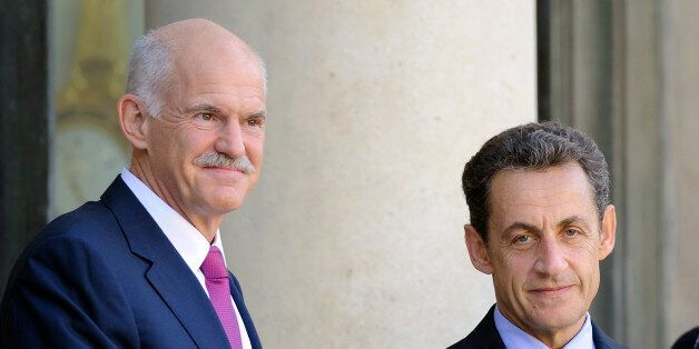 French President Nicolas Sarkozy (R) and Greek Prime Minister George Papandreou pose for photographers prior to a working meeting at the Elysee palace, on September 30, 2011 in Paris. AFP PHOTO ERIC FEFERBERG (Photo credit should read ERIC FEFERBERG/AFP/Getty Images)