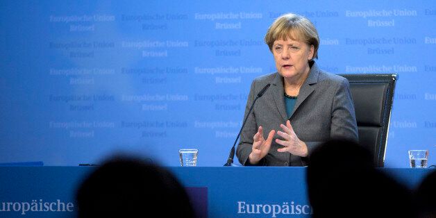 German Chancellor Angela Merkel speaks during a media conference at the end of an EU summit in Brussels on Thursday, Feb. 12, 2015. European Union leaders on Thursday said the full respect of the planned weekend cease-fire in eastern Ukraine will be essential before there could be a change in the sanctions regime imposed on Moscow. (AP Photo/Virginia Mayo)