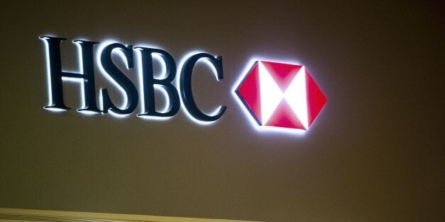 A picture taken on February 12, 2015 in the northern France city of Lille shows the logo of banking giant HSBC at one of the bank's branch. On February 8, documents published by the International Consortium of Investigative Journalists (ICIJ) showed the Swiss division of London-based HSBC helped wealthy clients evade taxes on accounts containing some $119 billion. The documents show that HSBC opened Swiss accounts for international criminals, businessmen, politicians and celebrities, according to the ICIJ. AFP PHOTO / PHILIPPE HUGUEN (Photo credit should read PHILIPPE HUGUEN/AFP/Getty Images)