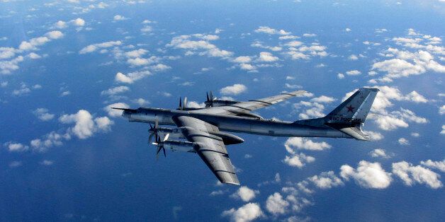In this photo provided by Britain's Royal Air Force and taken Wednesday, Oct. 29, 2014, a Russian military long range bomber aircraft photographed by an intercepting RAF quick reaction Typhoon (QRA) flies in international airspace. NATO is increasing its readiness and air policing following a spike in Russian air force activity in Eastern Europe, the alliance's new chief said Thursday. (AP Photo/Royal AIr Force)