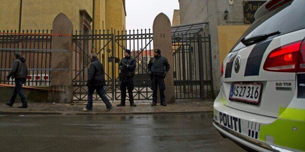 COPENHAGEN, DENMARK - FEBRUARY 15: Security forces stand guard around Jewish synagogue, located a few hundred meters from the NÃ¸rreport Station, on February 15, 2015 after one person was shot in the head and two policemen were shot in the arm and leg in Krystalgade, a street that is home to Copenhagen's main synagogue. (Photo by Freya Ingrid Morales/Anadolu Agency/Getty Images)