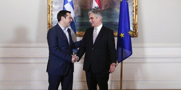Greek Prime Minister Alexis Tsipras (L) and Austrian Federal Chancellor Werner Faymann shake hands on February 9, 2015 in Vienna. Fierce negotiations were underway Monday between Greece and its EU creditors as a defiant PM Alexi Tspiras stuck to his anti-austerity guns and the clock ticked down to an extraordinary meeting in Brussels. AFP PHOTO / PATRICK DOMINGO (Photo credit should read Patrick Domingo/AFP/Getty Images)