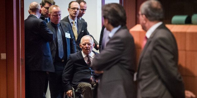 German Finance Minister Wolfgang Schaeuble, center, arrives for a meeting of Eurogroup finance ministers at the EU Council building in Brussels on Monday, Feb. 16, 2015. Greeceâs radical left government and its European creditors headed into new talks Monday on the debt-heavy countryâs stuttering bailout program, but expectations are low despite a fast-approaching deadline for some kind of deal. (AP Photo/Geert Vanden Wijngaert)