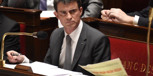 French Prime minister Manuel Valls is pictured during the debate held prior to parliamentary vote of confidence over the government's economic reforms, on February 19, 2015 at the French national Assembly in Paris. The confidence motion was sparked when Prime Minister Manuel Valls on February 17, 2015 employed a rarely-used constitutional device to force through a key package of reforms without a parliamentary vote. AFP PHOTO/ MARTIN BUREAU (Photo credit should read MARTIN BUREAU/AFP/Gett