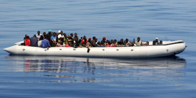 An inflatable hard bottom craft carrying some 87 would be immigrant mainly from Somalia is pictured 26 miles from Lampedusa on June 15, 2008 (AFP)