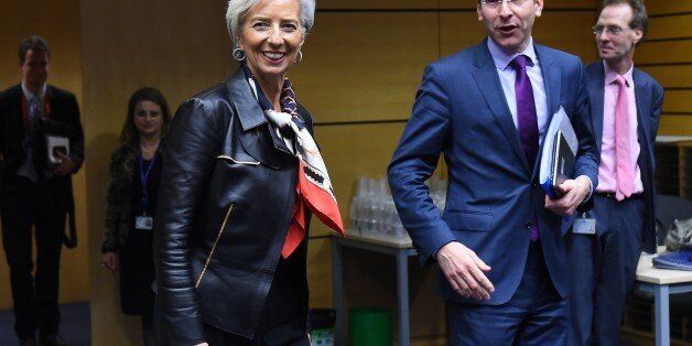 International Monetary Fund (IMF) Director Christine Lagarde (L) and Eurogroup President and Dutch Finance Minister Jeroen Dijsselbloem arrive for an emergency Eurogroup finance ministers meeting at the European Council in Brussels on February 11, 2015. Proposals by the new government in Athens to renegotiate the terms of its massive international bailout are scheduled to be discussed by eurozone finance ministers in Brussels on February 11 and 12. AFP PHOTO / EMMANUEL DUNAND (Photo credi