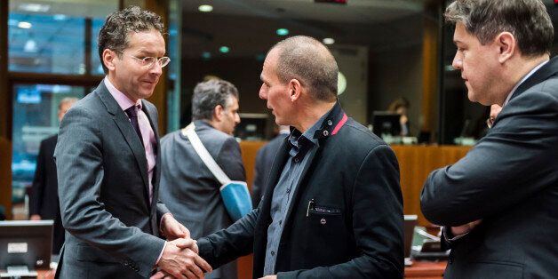 Greece's Finance Minister Yanis Varoufakis, center, greets Dutch Finance Minister Jeroen Dijsselbloem, left, as Croatian Finance Minister Boris Lalovac looks on during a meeting of EU finance ministers at the EU Council building in Brussels Tuesday, Feb. 17, 2015. Greek shares led a European retreat Tuesday as investors reacted negatively to the breakdown in talks between Greece and its creditors in the 19-nation eurozone over the country's attempt to renegotiate its financial bailout. (AP Photo