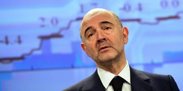 European Commissioner for Economic and Financial Affairs, Taxation and Customs, Pierre Moscovici unveils the European economic forecast, Winter 2015, at the European Commission headquarters in Brussels, on February 5, 2015. AFP PHOTO/Emmanuel Dunand (Photo credit should read EMMANUEL DUNAND/AFP/Getty Images)