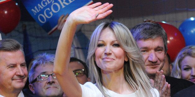 Polandâs leading left-wing candidate for president Magdalena Ogorek greets supporters during her electoral convention in Ozarow Mazowiecki, Poland, Saturday, Feb. 14, 2015. Ogorek criticized Polandâs current leadership for its strong critical stance toward Russia and suggested it bears some blame for the deep tensions between the two neighbors. The presidential election will be held May 10. (AP Photo/Alik Keplicz)
