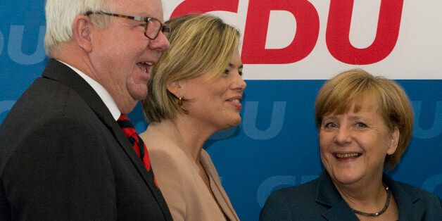 (L-R) Michael Fuchs, member of the CDU parlamentary fraction, Julia Kloeckner, Vice-Chairman of the CDU and German Chancellor Angela Merkel and candidate of the German Christian Democratic Union (CDU) party arrive for their party's executive board meeting at the headquarters at the Konrad-Adenauer-House in Berlin on September 16, 2013 a week ahead of the German general elections. AFP PHOTO / JOHN MACDOUGALL (Photo credit should read JOHN MACDOUGALL/AFP/Getty Images)