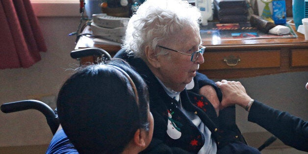 Mother Patricia Mary, right, and nurse Friary Nguyen visit 99-year-old resident Helen Reichenbach in her room at the Mullen Home for the Aged, run by Little Sisters of the Poor, in Denver, Thursday Jan. 2, 2014. Acting at the request of Little Sisters of the Poor, Justice Sonia Sotomayor on Tuesday Dec. 31, 2013, temporarily blocked the Obama administration from forcing some religious-affiliated groups to provide health insurance coverage of birth control or face penalties as part of the Affordable Care Act. The stay was issued just hours before the requirement was to go into effect on New Yearâs Day. (AP Photo/Brennan Linsley)