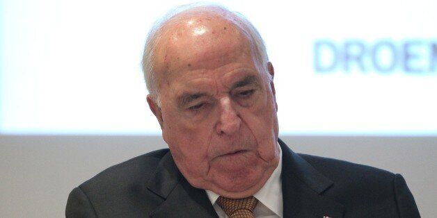 Former German Chancellor Helmut Kohl's reads his book during the presentation of Kohl's book titled 'Out of Concern for Europe' in Frankfurt am Main, western Germany, on November 3, 2014. Former German chancellor Helmut Kohl has lashed out at his successors again in a new book coming out this week, blasting their policies on Russia and the euro. AFP PHOTO / DANIEL ROLAND (Photo credit should read DANIEL ROLAND/AFP/Getty Images)