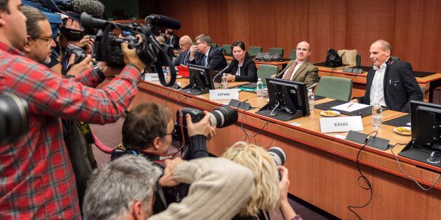Greek Finance Minister Yanis Varoufakis, right, and Spanish Economy Minister Luis de Guindos, second right, are photographed during a round table meeting of eurogroup finance ministers in Brussels on Friday, Feb. 20, 2015. Eurozone finance ministers meet for a crucial day of talks Friday to see whether a Greek debt relief proposal is acceptable to Germany and other nations using the common currency. (AP Photo/Geert Vanden Wijngaert)