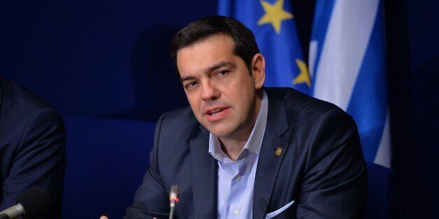 BRUSSELS, BELGIUM - FEBRUARY 12: Greek Prime Minister Alexis Tsipras speaks during a press conference after the European Union Leaders Summit at the European Council headquarters in Brussels, Belgium, on February 12, 2015. (Photo by Dursun Aydemir/Anadolu Agency/Getty Images)