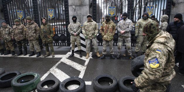 KIEV, UKRAINE - JANUARY 30: Volunteer soldiers' battalion 'Aydar' blocking the roadway in front of the Ministry of Defense, during a protest in Kiev, Ukraine on January 30, 2015. Soldiers protest against the disbandment of their battalion. (Photo by Vladimir Shtanko/Anadolu Agency/Getty Images)