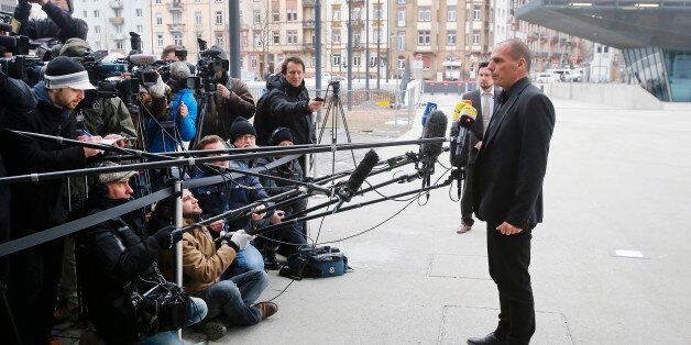 Greek Finance Minister Yanis Varoufakis speaks to journalists after a meeting with the President of the European Central Bank Mario Draghi in Frankfurt, Germany, Wednesday, Feb. 4, 2015. (AP Photo/Michael Probst)