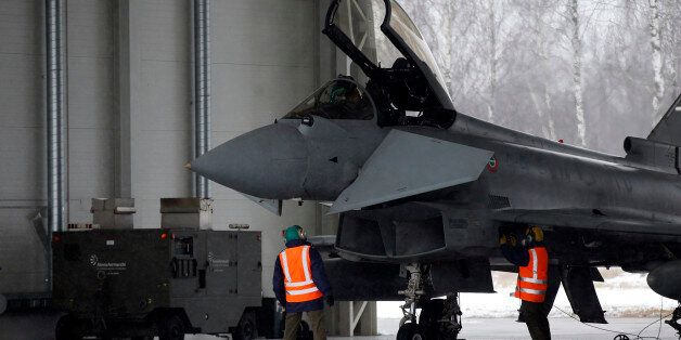Italy's Eurofighter Typhoon jet fighter prepares for take off during NATO's Baltic Air Policing Mission at the Siauliai airbase some 240 kms (150 miles) east of the capital Vilnius, Lithuania, Thursday, Jan. 29, 2015. (AP Photo/Mindaugas Kulbis)