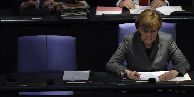 German Chancellor Angela Merkel attends a session of the Bundestag (German lower house of parliament) in Berlin January 29, 2015. AFP PHOTO / TOBIAS SCHWARZ (Photo credit should read TOBIAS SCHWARZ/AFP/Getty Images)