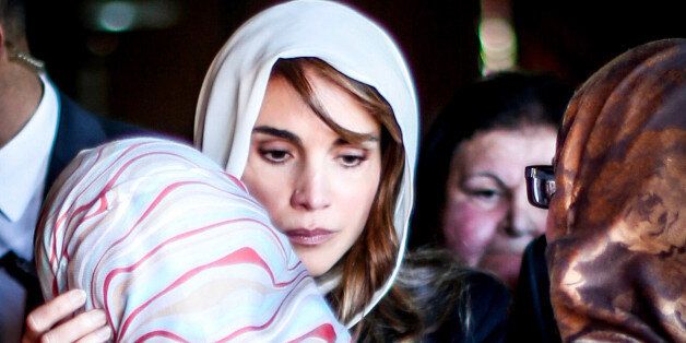 AEY, JORDAN- FEBRUARY 5: Queen Rania of Jordan consoles Anwar Al Tarawneh, the wife of the Jordanian pilot Muath Al Kasasbeh, who was burned to death after being held hostage by Islamic State (IS) on February 5, 2015, in Aey, Jordan. Muath al-Kasaesbeh was captured by the terror group after crashing his plane near Raqqa in northern Syria, during a mission against IS in December. (Photo by Jordan Pix/ Getty Images)