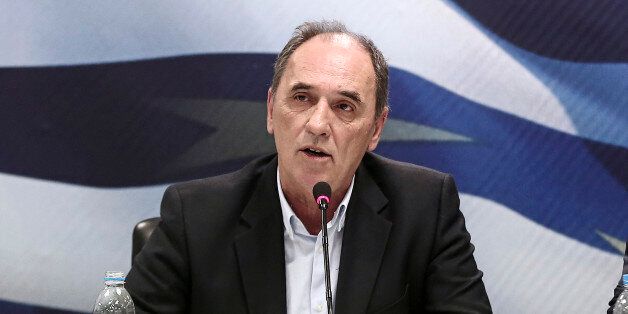 George Stathakis, Greece's incoming minister for economy, shipping, tourism and infrastructure, speaks during a handover ceremony in Athens, Greece, on Wednesday, Jan. 28, 2015. Varoufakis, is gearing up for negotiations with the euro area that have been on hold since December as Greece entered an election campaign. Photographer: Yorgos Karahalis/Bloomberg via Getty Images *** George Stathakis