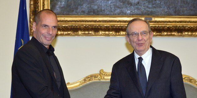 Greek Minister of Finance Yanis Varoufakis (L) shakes hands with his Italian counterpart Pier Carlo Padoan during their meeting on February 3, 2015 in Rome. Greece sought to add Italy to its supporters in a fight to secure easier terms on the country's massive debt after unveiling new proposals to end a stand-off with international lenders. Greek Finance Minister Yanis Varoufakis told international financiers in London yesterday that the leftist-dominated government in Athens would be making proposals for 'a menu of debt swaps' that would avoid the need for any of the country's 315-billion-euro mountain of foreign debt to be written off. AFP PHOTO / TIZIANA FABI (Photo credit should read TIZIANA FABI/AFP/Getty Images)