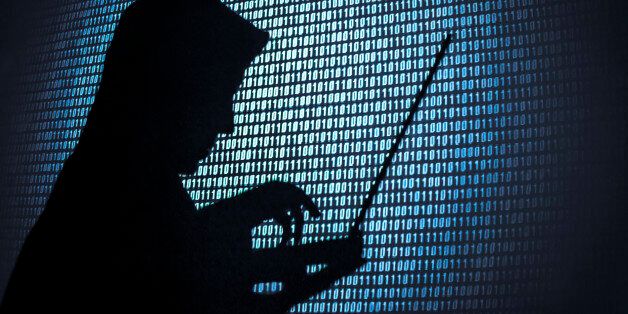 Computer hacker silhouette. Blue binary code background. Seattle office.