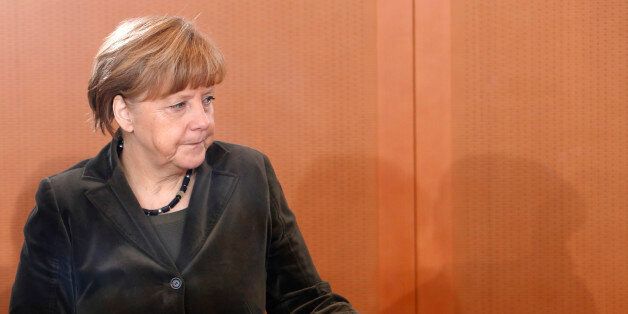 German Chancellor Angela Merkel arrives for the weekly cabinet meeting in Berlin Wednesday, Feb. 4, 2015. (AP Photo/Ferdinand Ostrop)