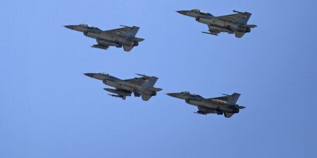 Jordanian Air Force fighter jets fly during the funeral of slain Jordanian pilot, Lt. Muath al-Kaseasbeh, at his home village of Ai, near Karak, Jordan, Wednesday, Feb. 4, 2015. Outrage and condemnation poured across the Middle East on Wednesday as horrified people learned of the video purportedly showing the Islamic State group burn a Jordanian pilot to death. (AP Photo/Nasser Nasser)
