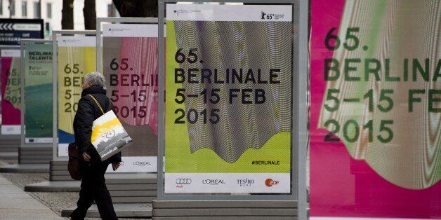 A woman walks by bildboards featuring ad for the 65th edition of the Berlinale Film Festival on the Potsdamer Platz, in Berlin January 23, 2015. This year's edition takes place from 05 to 15 February, 2015. AFP PHOTO / JOHN MACDOUGALL (Photo credit should read JOHN MACDOUGALL/AFP/Getty Images)