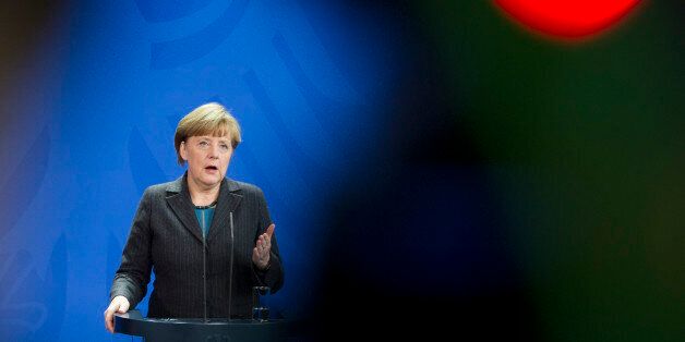 German Chancellor Angela Merkel addresses the media during a joint press conference as part of a meeting with Prime Minister of Singapore Lee Hsien Loong at the chancellery in Berlin, Germany, Tuesday, Feb. 3, 2015. (AP Photo/Steffi Loos)