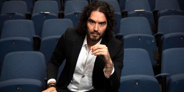 LONDON, ENGLAND - NOVEMBER 25: Russell Brand poses for photographs as he arrives to deliver The Reading Agency Lecture at The Institute of Education on November 25, 2014 in London, England. Russell Brand will deliver 'a manifesto on reading' which will be in part personal, sharing his own experience of books and reading while growing up in the UK. (Photo by Carl Court/Getty Images)