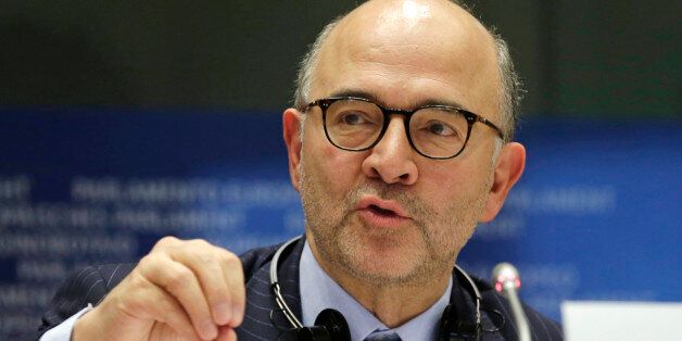 European Commissioner for Economic and Financial Affairs Pierre Moscovici addresses the Committee on Economic and Monetary Affairs on the draft budgetary plans of euro area member states, at the European Parliament building, in Brussels on Tuesday, Dec. 2, 2014. (AP Photo/Yves Logghe)