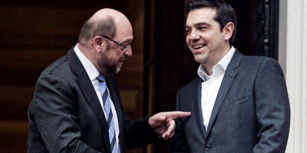 ATHENS, GREECE , JANUARY 29: Greek Prime Minister Alexis Tsipras (R) greets European Parliament President Martin Schulz at his office prior to their meeting on January 29, 2015 in central Athens, Greece. The radical left party Syriza won the snap Greek general election and asked the right-wing Independent Greek party to form an anti-austerity coalition. (Photo by MIlos Bicanski/Getty Images)