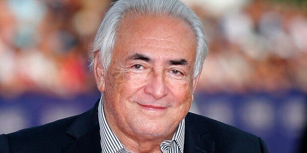 FILE - This Saturday, Sept. 13, 2014, file photo shows former IMF Secretary General Dominique Strauss-Kahn arriving for the award ceremony at the 40th American Film Festival in Deauville, Normandy, western France. The French economist known universally by his initials DSK, faces up to 10 years in prison and a 1.5 million euro ($1.7 million) fine on charges of aggrevated pimping, along with over a dozen other French and Belgian businessmen and police officers at the trial beginning Monday at a co