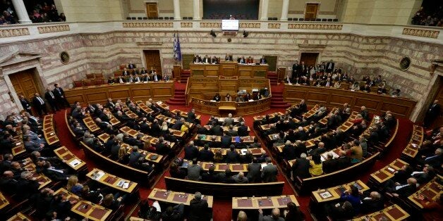 Greece's lawmakers attend the second round of voting to elect a new Greek president at the Parliament in Athens on Tuesday, Dec. 23, 2014. Greek lawmakers have failed to elect the countryâs new president in a second round of voting, leaving the government with a final attempt next week to break an impasse that could force early elections. The conservative-led governmentâs candidate, Stavros Dimas, received 168 votes in Tuesdayâs ballot, far short of the 200 needed for his election. (AP Photo/Thanassis Stavrakis)