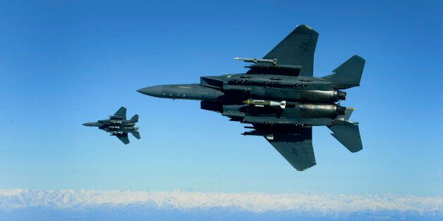 U.S. Air Force F-15E Strike Eagles, from the 335th Expeditionary Fighter Squadron, circle around a cave in eastern Afghanistan after bombing it with 2,000 pound Joint Direct Attack Munitions, Nov. 26, 2009. The 335th is deployed to Bagram Airfield, Afghanistan, from Seymour Johnson Air Force Base, N.C. (U.S. Air Force photo by Staff Sgt. Michael B. Keller)