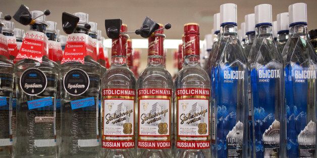 Bottles of Stolichnaya Russian vodka sit on a shelf inside a Dixy supermarket operated by OAO Dixy Group in Moscow, Russia, on Tuesday, April 8, 2014. Suppliers suffering from ruble depreciation this quarter are urging retailers to increase prices. Photographer: Andrey Rudakov/Bloomberg via Getty Images