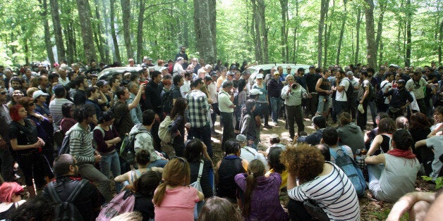 Local groups in Megali Panagia, Chalkidiki, northern Greece, protest against efforts by Hellenic Gold, a subsidiary of Canadian firm Eldorado Gold, to mine the Skouries quarry on Mount Kakkavos on May 1, 2012. 'The struggle for water and nature is a struggle for life and will always prevail,' they said with threats of taking more action. AFP PHOTO / Sakis Mitrolidis (Photo credit should read SAKIS MITROLIDIS/AFP/GettyImages)