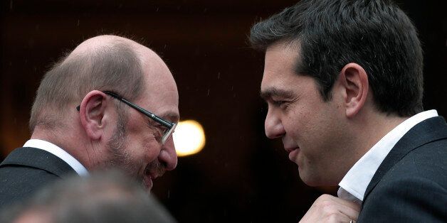 Greek Prime Minister Alexis Tsipras, right, greets European Parliament President Martin Schulz, left, at his office prior to their meeting in central Athens, Thursday, Jan. 29, 2015. (AP Photo/Lefteris Pitarakis)
