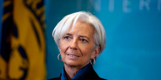 International Monetary Fund (IMF) Managing Director Christine Lagarde, waits to greet British Prime Minister David Cameron, before a round table meeting at the IMF, Thursday, Jan. 15, 2015 in Washington. (AP Photo/Alex Brandon)