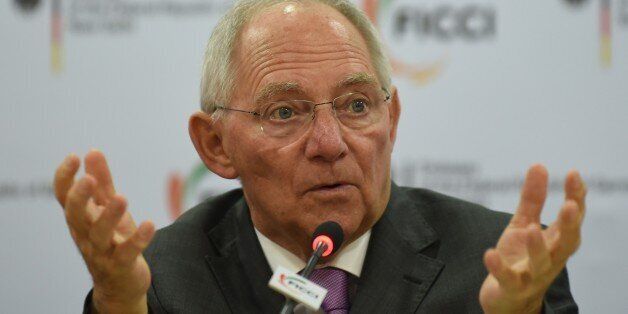 German Finance Minister Wolfgang Schauble delivers his address during a function entitled 'Europe and India in the face of Globalisation' organised by the Federation of Indian Chambers of Commerce and Industry (FICCI) in New Delhi on January 20, 2015. Germany's finance minister was looking to reassure India that the eurozone is not about to lurch into a fresh crisis ahead of talks with his counterpart in New Delhi. AFP PHOTO / SAJJAD HUSSAIN (Photo credit should read SAJJAD HUSSAIN/AFP/Ge