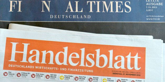 HAMBURG, GERMANY - DECEMBER 07: The final issue of the Financial Times Deutschland daily newspaper is seen on a issue of the Handelsblatt, its biggest competitioner, on December 7, 2012 in Hamburg, Germany. Gruner + Jahr launched the paper in 2000 and its management recently decided to cease publication given that the paper had failed every year to make a profit. Germany has been hit by several media bankruptcies in recent months, including the Frankfurter Rundschau daily newspaper and the DAPD news agency. (Photo by Patrick Lux/Getty Images)