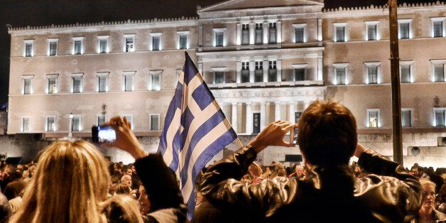 ATHENS, GREECE - FEBRUARY 5: Thousands of demonstrators gather outside the Greek parliament in support of the new government's tough stance with the EU, on February 5, 2015 in Athens, Greece. Greek Foreign Minister Yanis Varoufakis urged Germany to help end his country's indignity. German Foreign Minister Wolfgang Schaeuble suggested that a reduction in Greece's 322 billion Euro debt was not on the agenda. (Photo by Milos Bicanski/Getty Images)